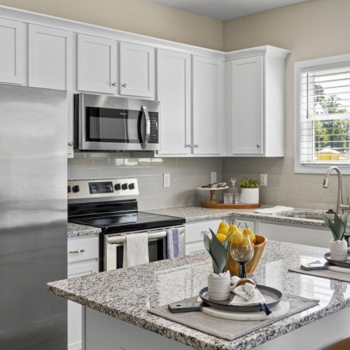 a kitchen with white cabinets