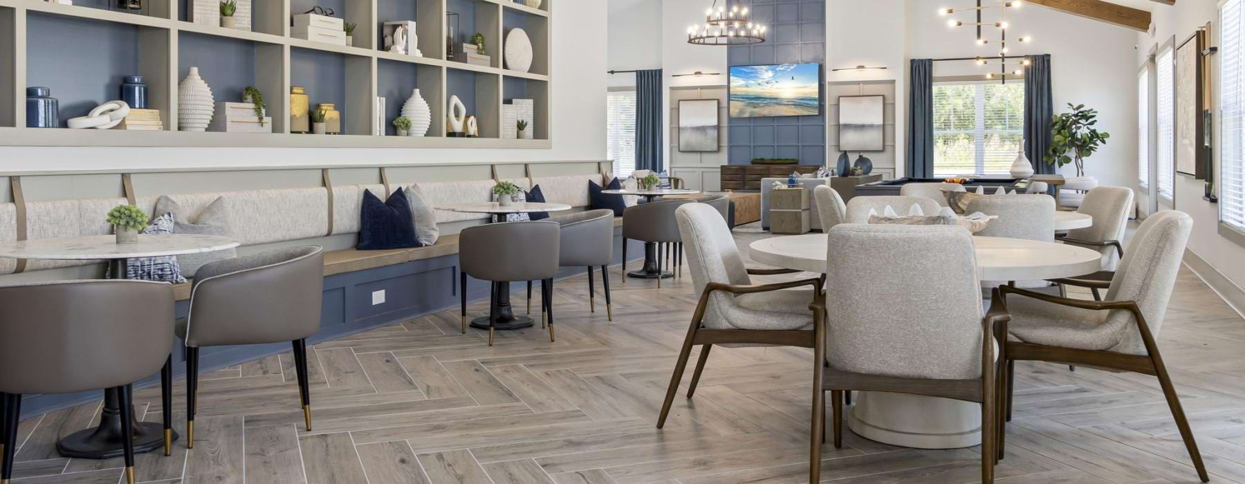 a large room with a table and chairs