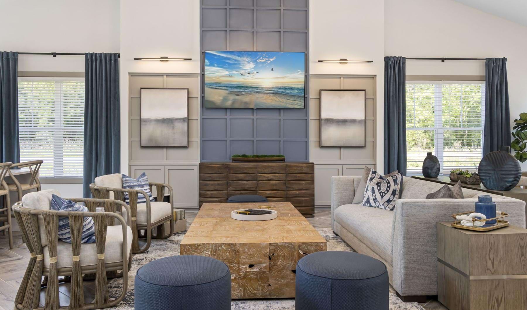 a spacious room with a couch and a table and a tv
