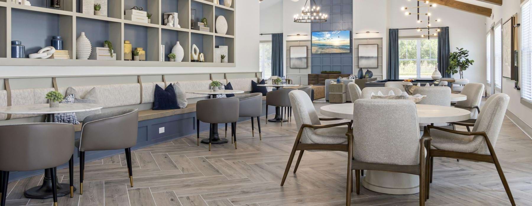 a large room with a table and chairs