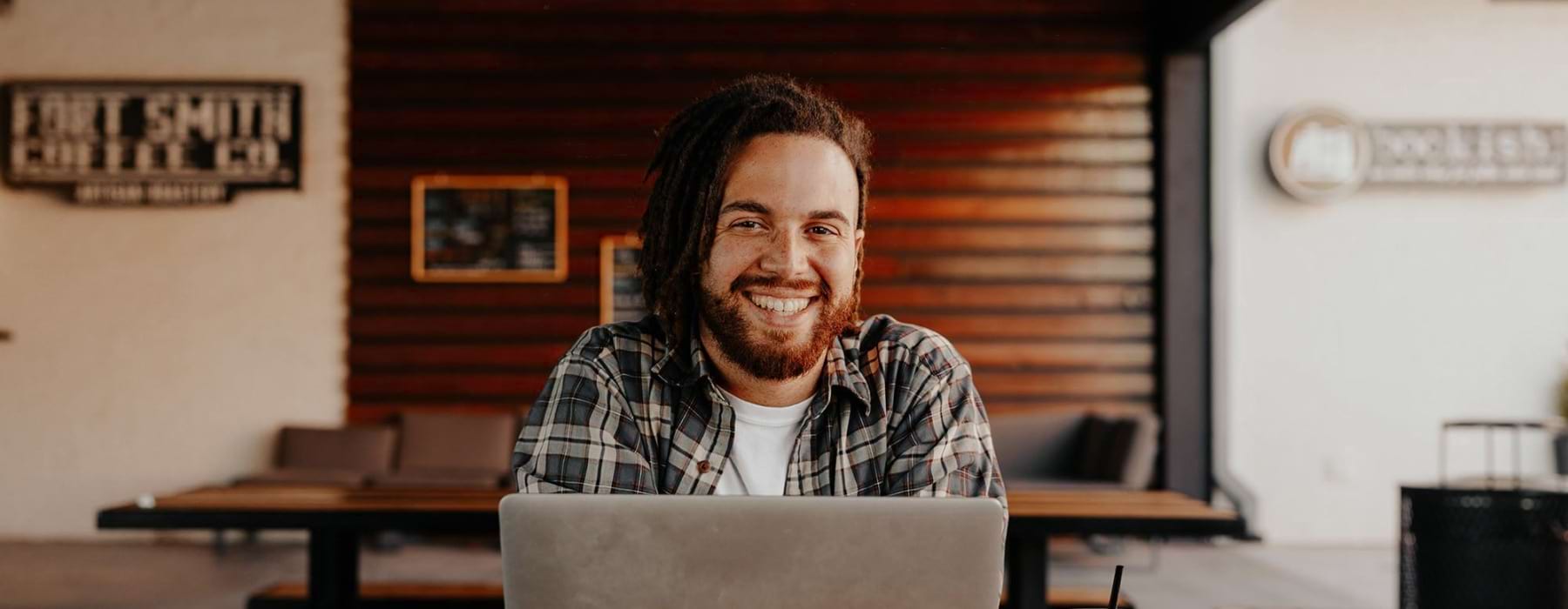 a man at a computer in a spacious room