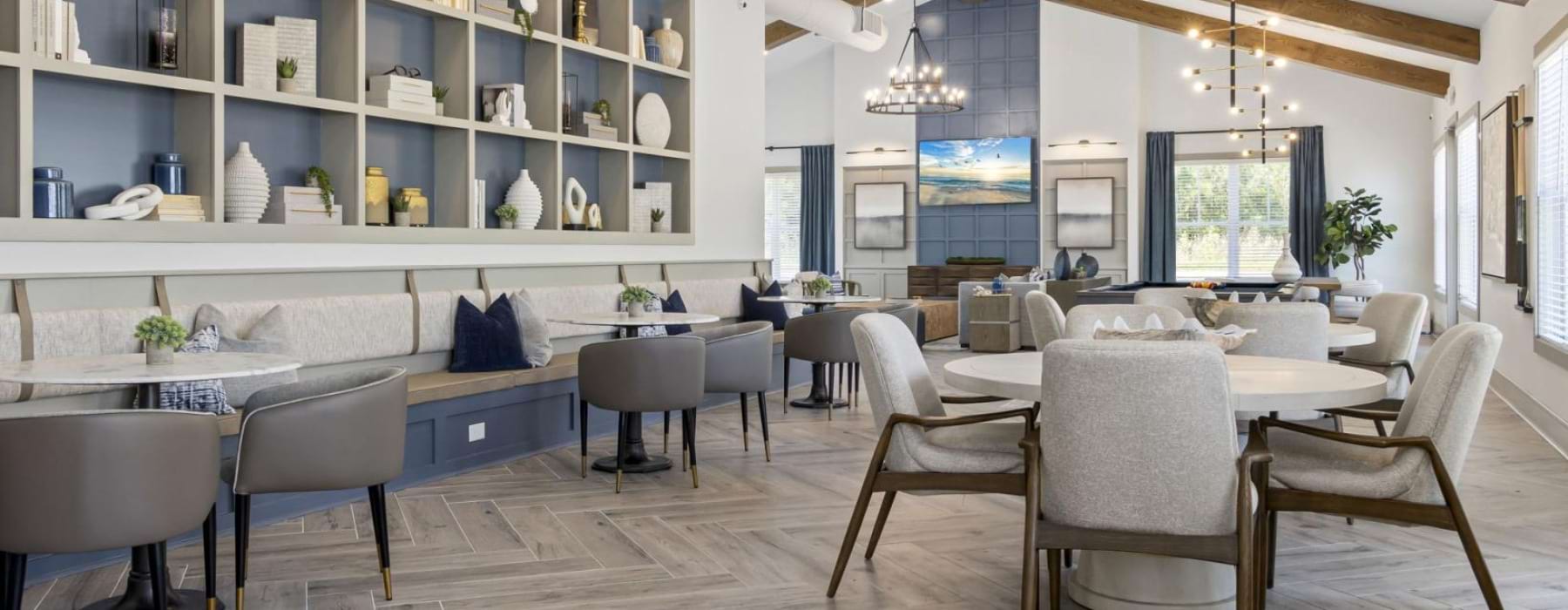 a large room with a table and chairs